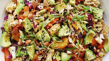 broken ramen noodle pieces with almonds, avocado, cabbage, carrots, and mandarin oranges