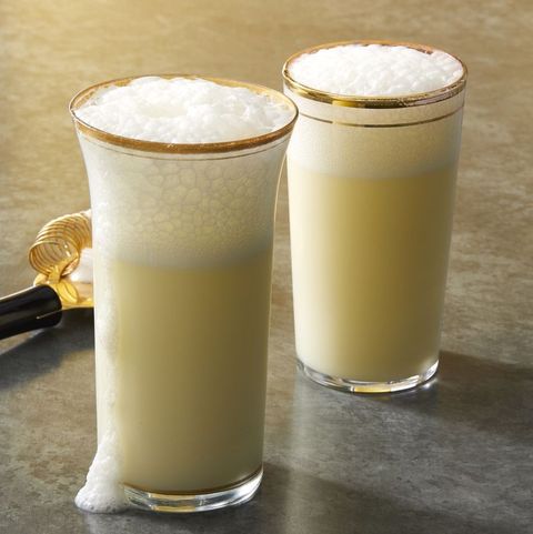 ramos gin fizz in gold rimmed glasses