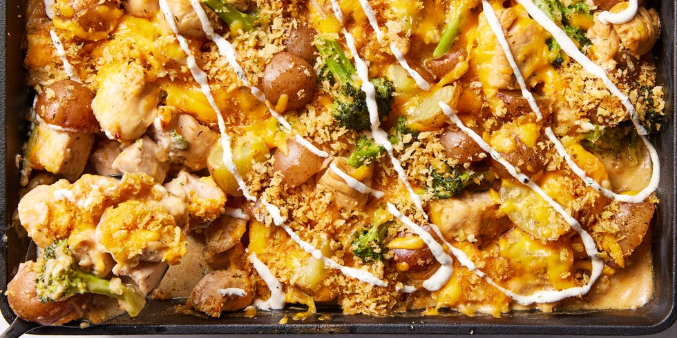 chicken with potatoes, broccoli, melted cheese, and drizzled with ranch in a casserole dish