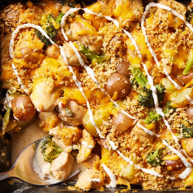 chicken with potatoes, broccoli, melted cheese, and drizzled with ranch in a casserole dish