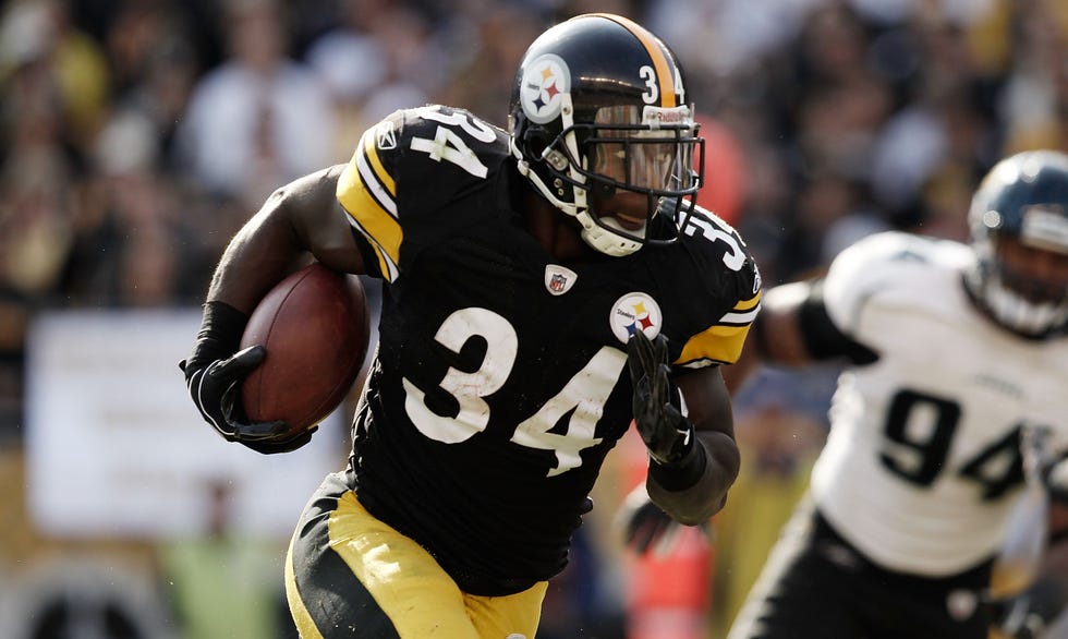 Pittsburgh Steelers' running back Rashard Mendenhall holds up the Lamar  Hunt Trophy after the Steelers defeated the New York Jets 24-19, winning  the AFC Championship, at Heinz Field in Pittsburgh, Pennsylvania on