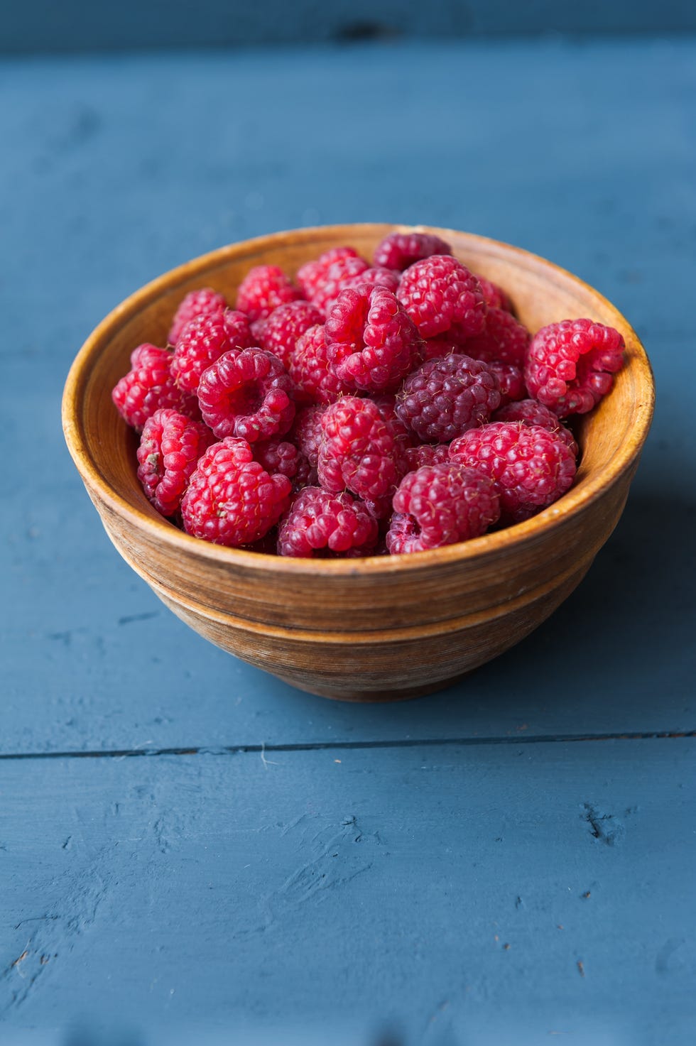 raspberries in a wooden bowl