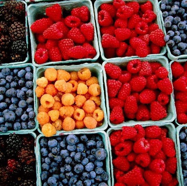 raspberry, blueberry and blackberry punnets at farmers market.