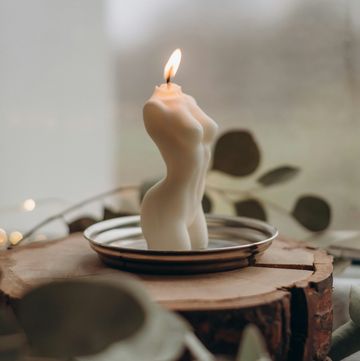 a candle on a plate