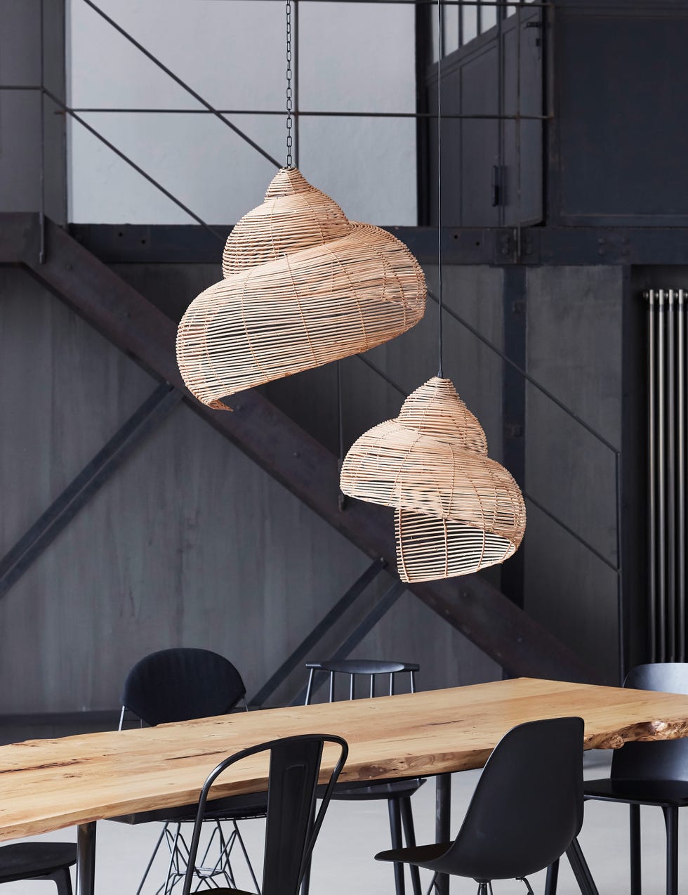 a industrial style kitchen featuring rattan natural shell light shades