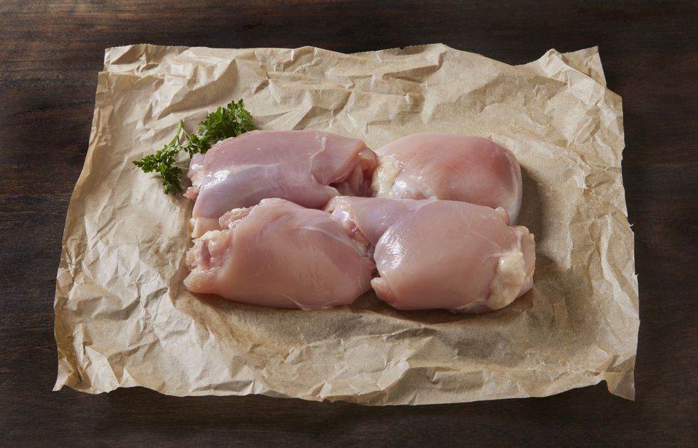 raw organic chicken thighs on butcher paper