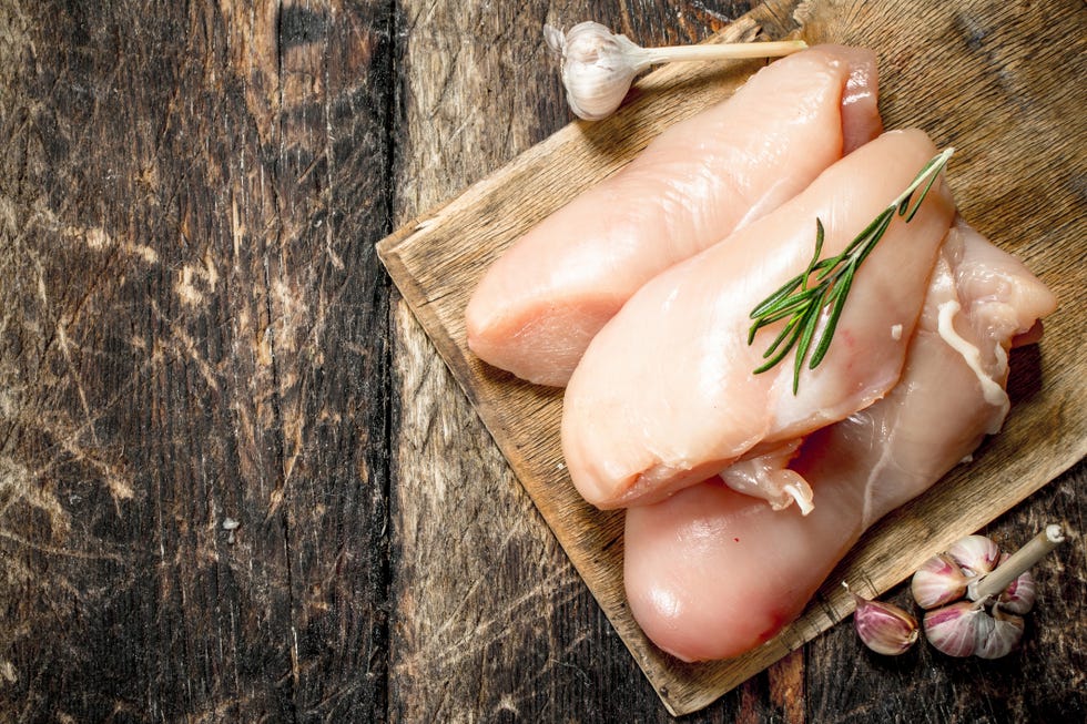 raw chicken fillet with garlic and herbs