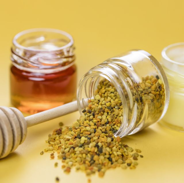 raw organic bee pollen, royal jelly and honey in jar bee pollen granules apitherapy