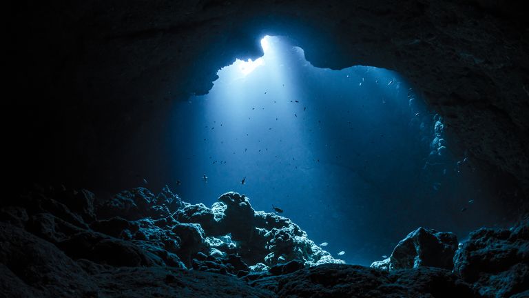 rays of sunlight into the underwater cave