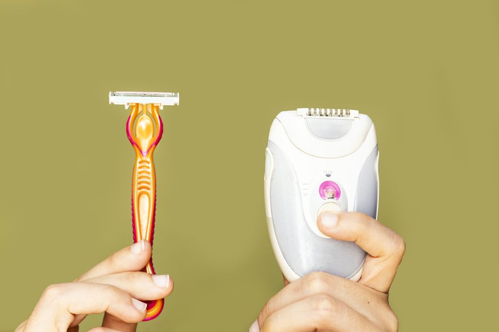razor or shaver and epilator in woman hand