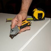 razor cutting drywall
