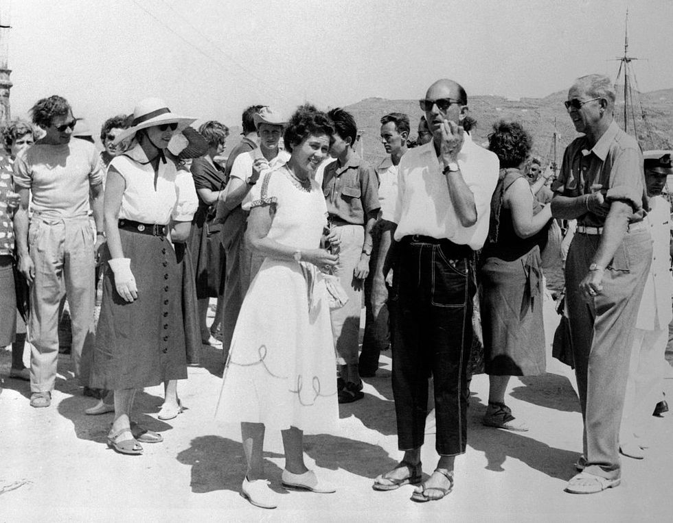 original caption european royalty taking the cruise through the aegan sea aboard the greek liner agamemnon, wait for transportation after landing at the island of mykonos left to right prince christian of hanover maria jose, wife of ex king umberto of italy greek queen frederika, sister of prince christian ex king umberto, wearing the european version of blue jeans and king paul of greece