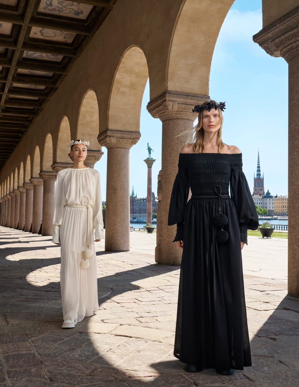 a couple of women in black dresses