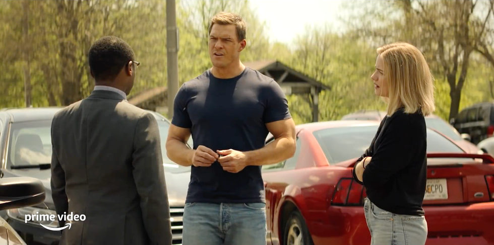 jack reacher, oscar finley and roscoe conklin standing in a car park talking in tv series reacher