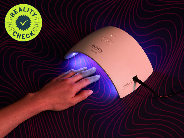hand under uv nail lamp for manicure safety test