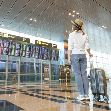 rear tourist woman at international airport