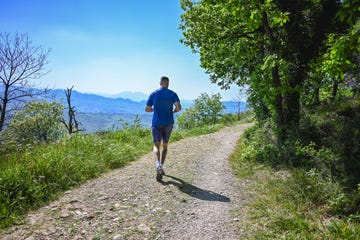 rear view of man running in hills
