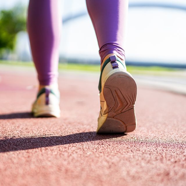 rear view of runner shoes on a running track.