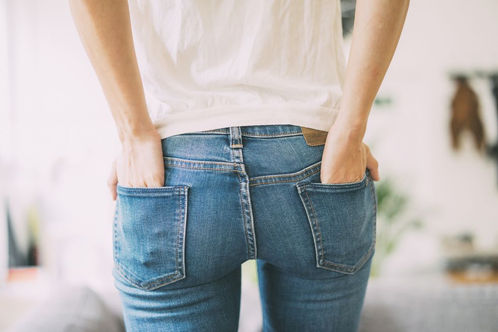 rear view of young woman wearing jeans