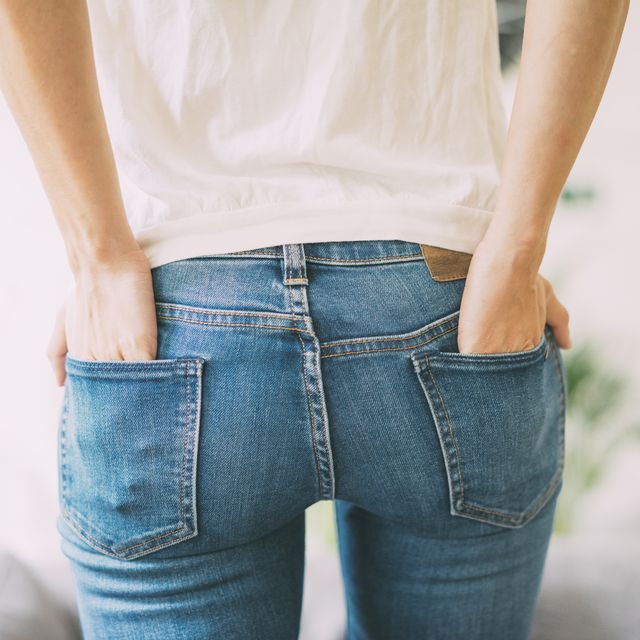Rear view of young woman wearing jeans