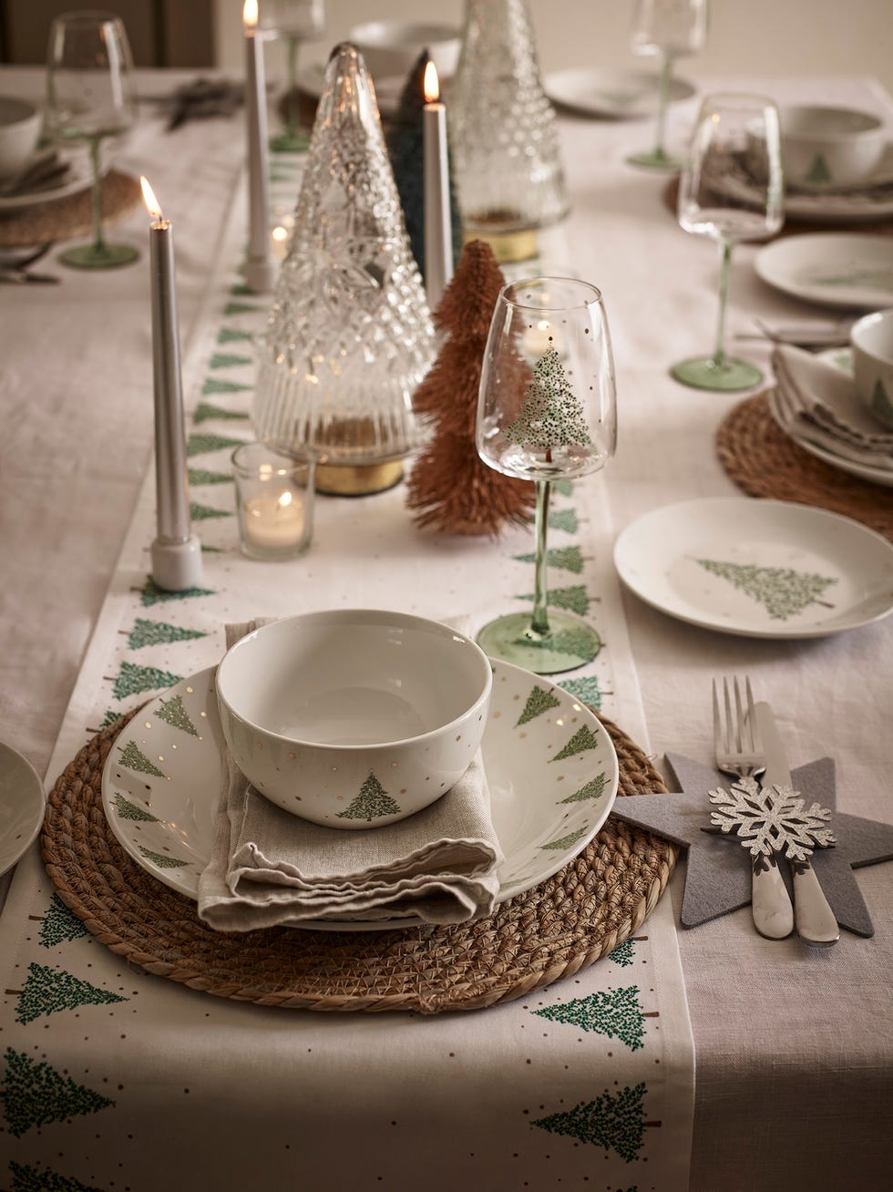 table laid with white crockery for christmas