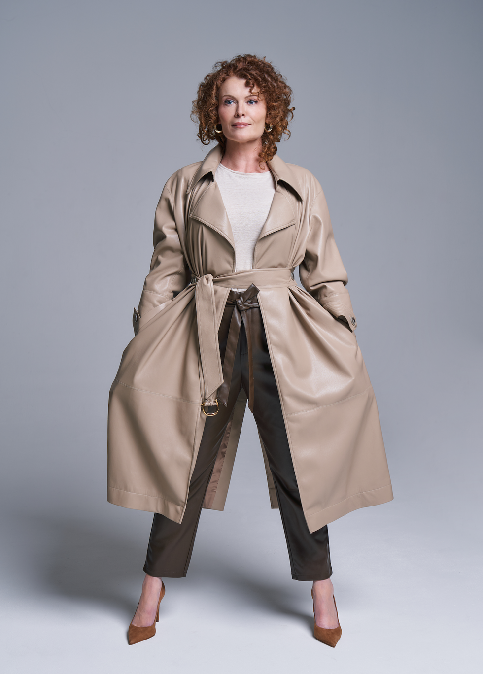 rebecca wisocky posing in a trench coat
