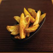 Food, Wood, Yellow, Fried food, Potato wedges, Deep frying, French fries, Side dish, Ingredient, Dish, 