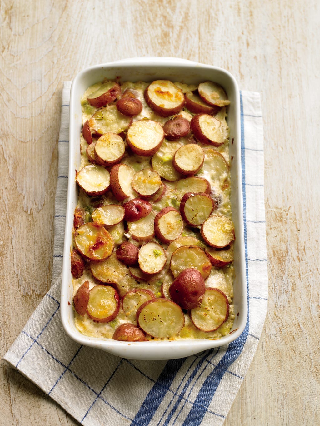 scalloped-red-potatoes-1456501976.jpg?crop=1xw:0.375xh;center,top