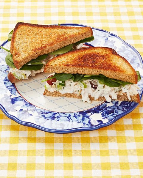 chicken salad sandwich on white bread with blue floral plate