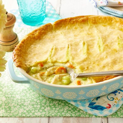 classic pot pie in light blue baking dish with spoon