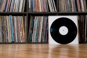 Records leaning against shelves