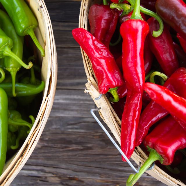 Red and Green Chile Peppers in Bushel Baskets