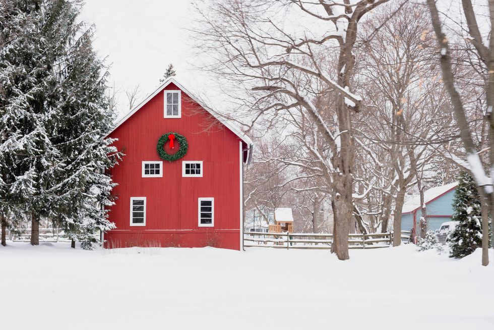 red barn in the snow  rural winter scene