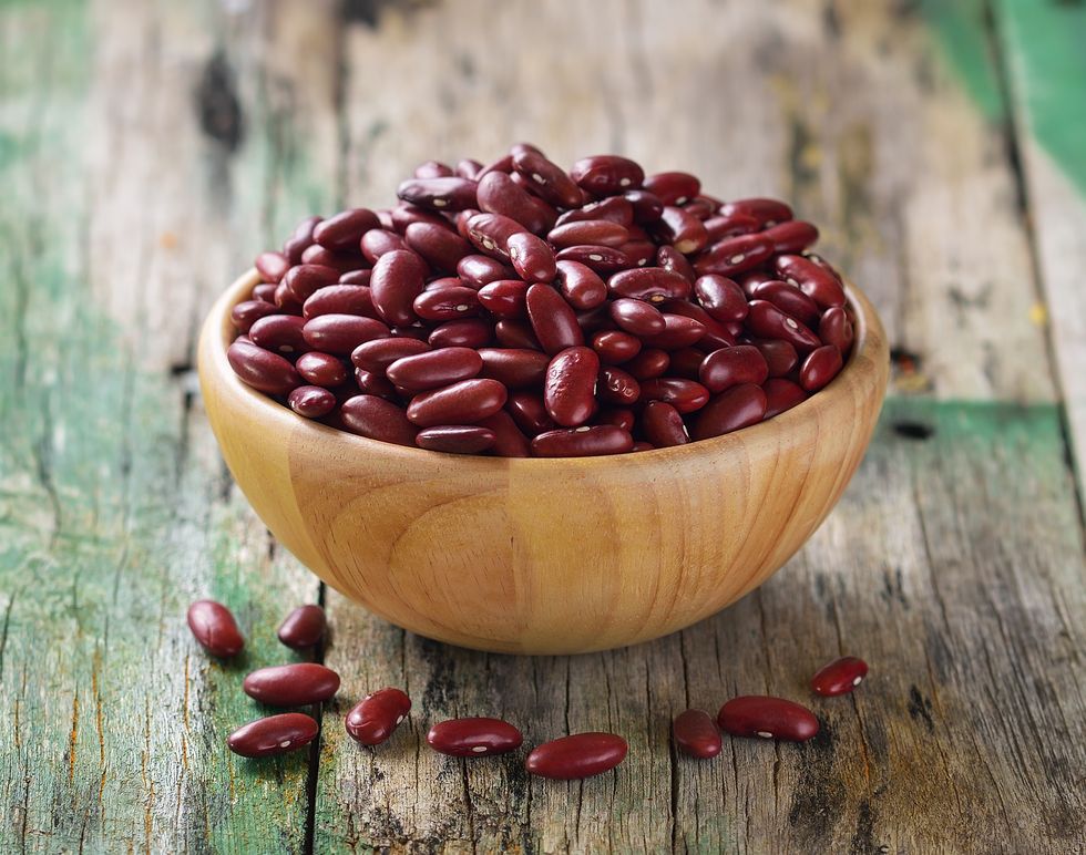 red beans in the wooden bowl on old wooden,romania
