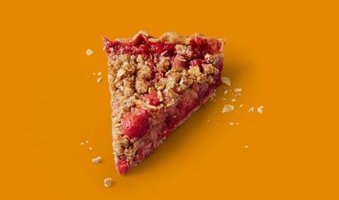 slice of red berry rhubarb pie on a digital orange background