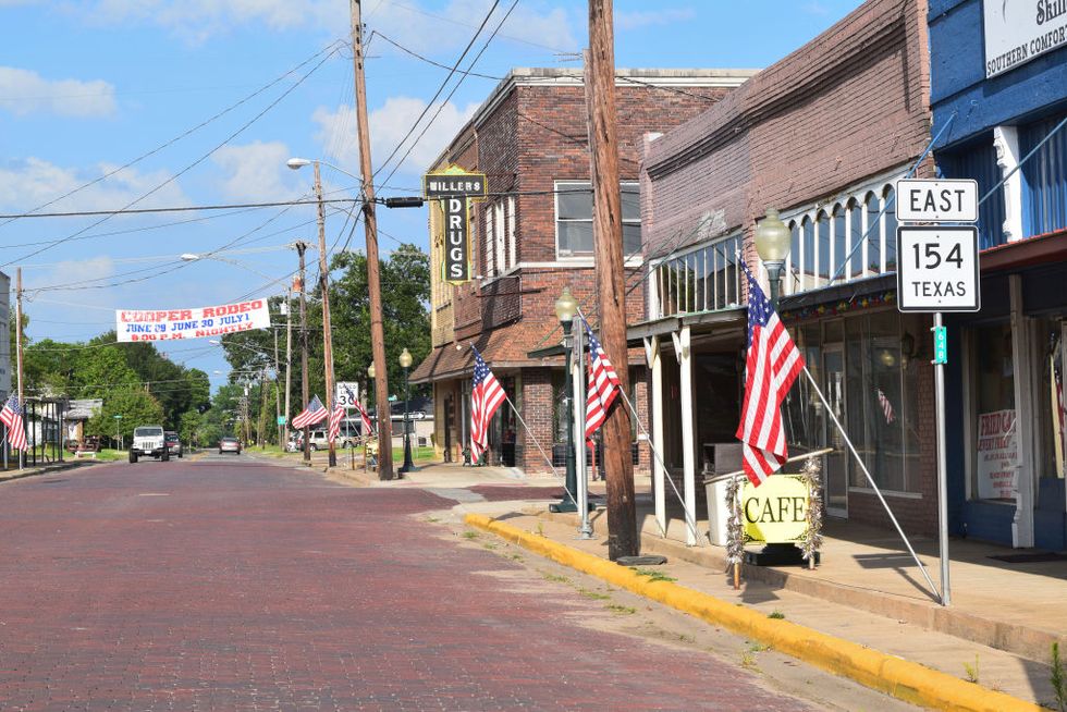 red brick street in downtown cooper, tx traditional small town in northeast texas