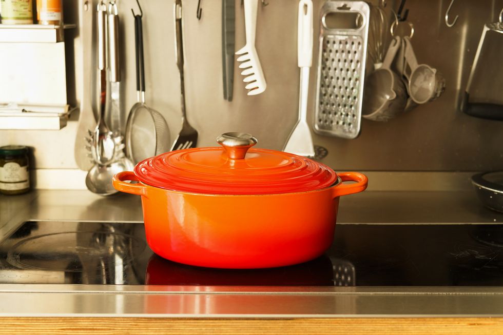 red cast iron pan on kitchen stove