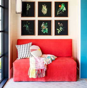 red color theory, a red sofa in a room