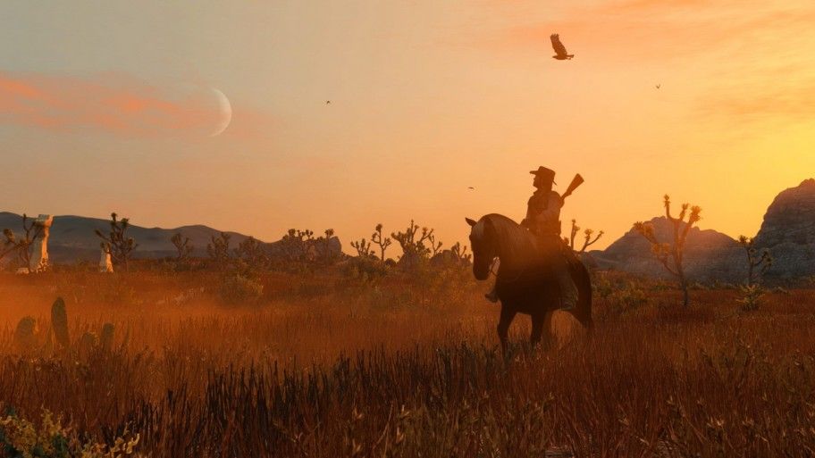 Red Dead Redemption Nintendo Switch-Screenshot, John Marston auf seinem Pferd vor einem Sonnenuntergang im Hintergrund