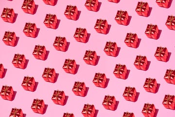 https://hips.hearstapps.com/hmg-prod/images/red-gift-box-on-pink-background-royalty-free-image-1696435828.jpg?crop=0.66745xw:1xh;center,top&resize=360:*