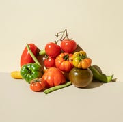raw food diet Red,green tomatoes, carrots and green beans on the beige background raw food diet red,green tomatoes, carrots and green beans on the beige background
