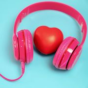red heart with headphones on blue background