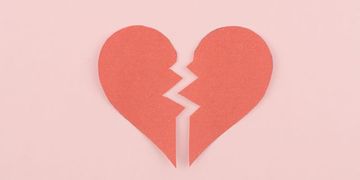 Red heartbreak / broken heart on pink background