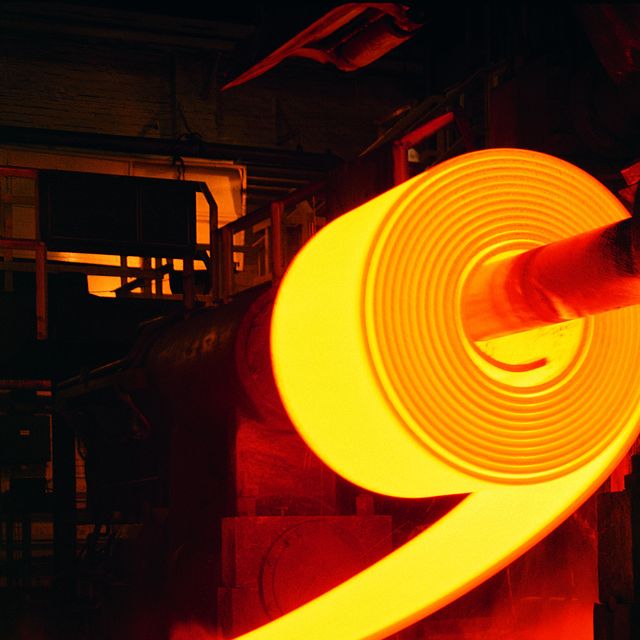 red hot roll of steel in steel mill