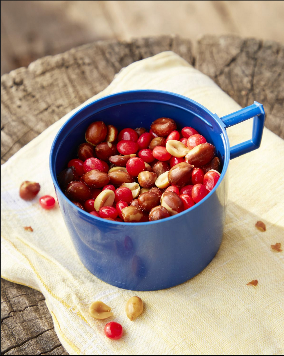 red hots and peanut snack mix in a thermos top