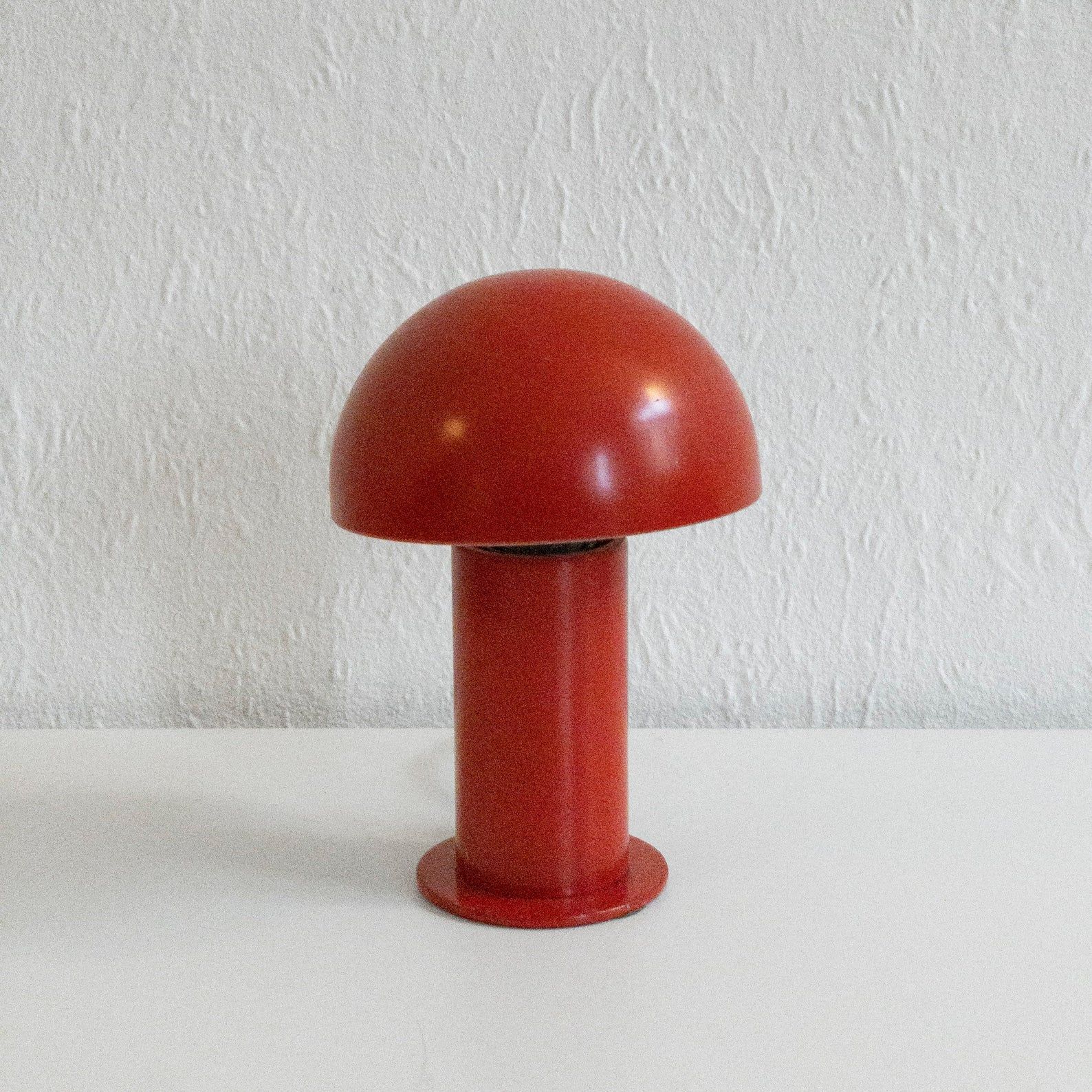 red lamp on white table