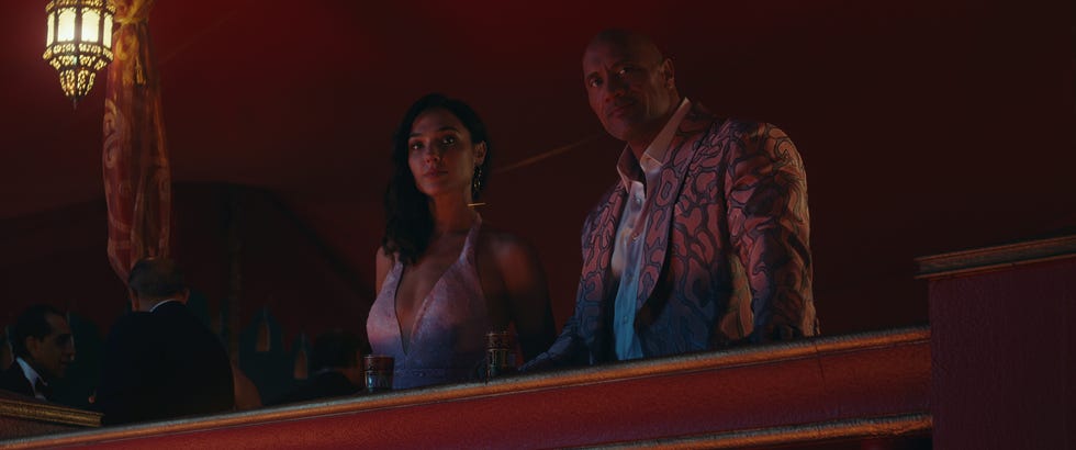 red notice l to r gal gadot as the bishop and  dwayne johnson as john hartley in red notice cr netflix © 2021