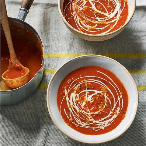 red pepper and tomato soup with creme fraiche drizzled on top