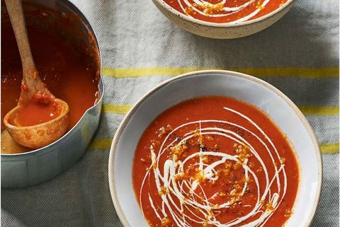red pepper and tomato soup with a drizzle of creme fraiche