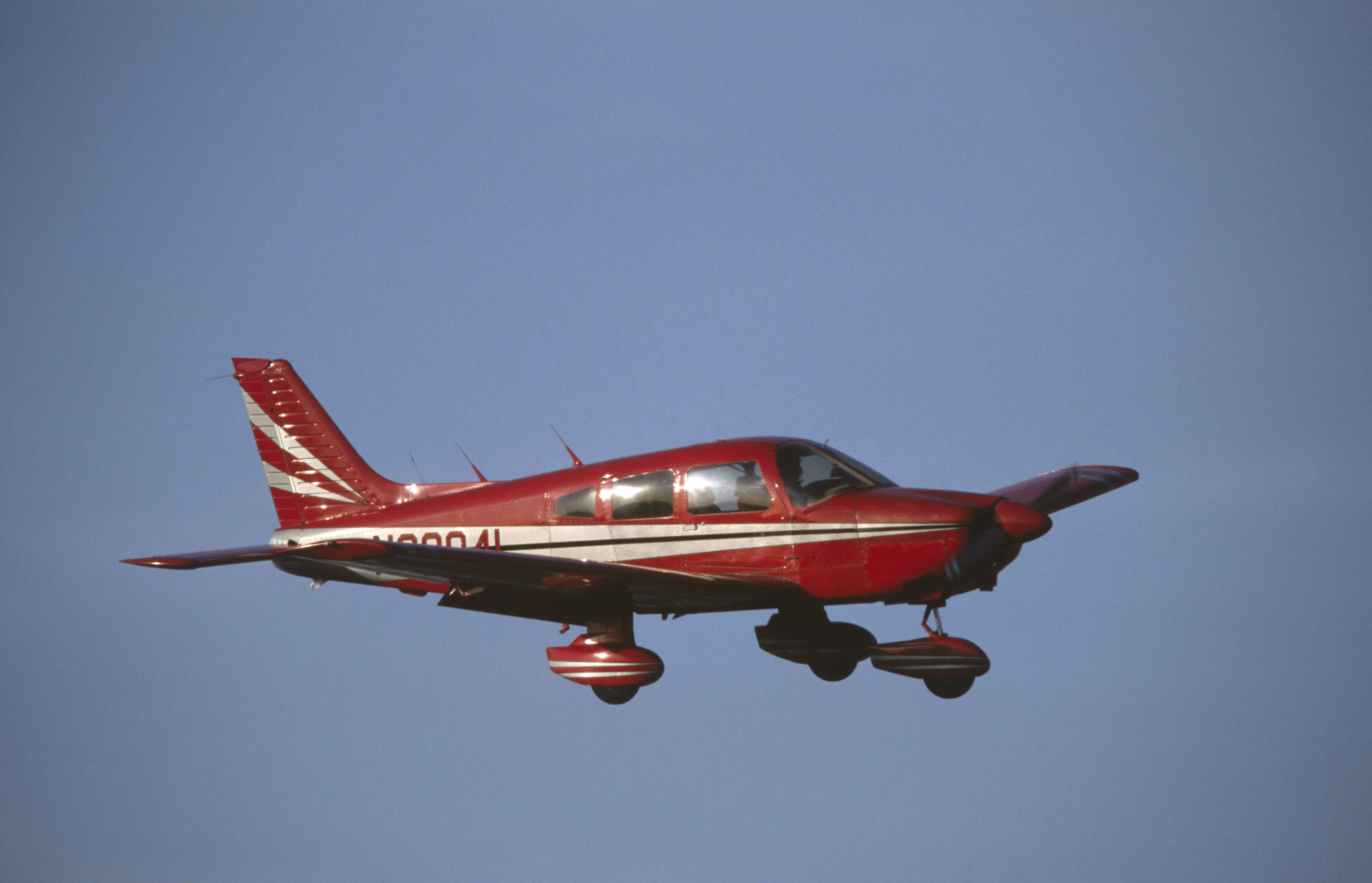 red Piper PA-28 Cherokee flying enroute